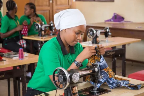 Tailoring trainee at a sewing machine
